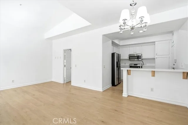 Living area and kitchen with breakfast bar at 1473 Holcomb Pl